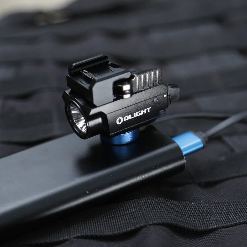 Latarka z celownikiem laserowym Olight BALDR Mini - 600 lumenów, zielony laser