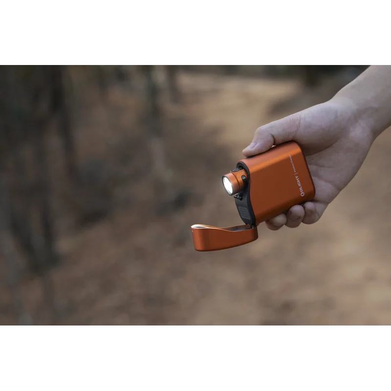 Latarka Olight Baton 4 Premium Edition z bezprzewodowym etui ładującym Pomarańczowa - 1300 lumenów